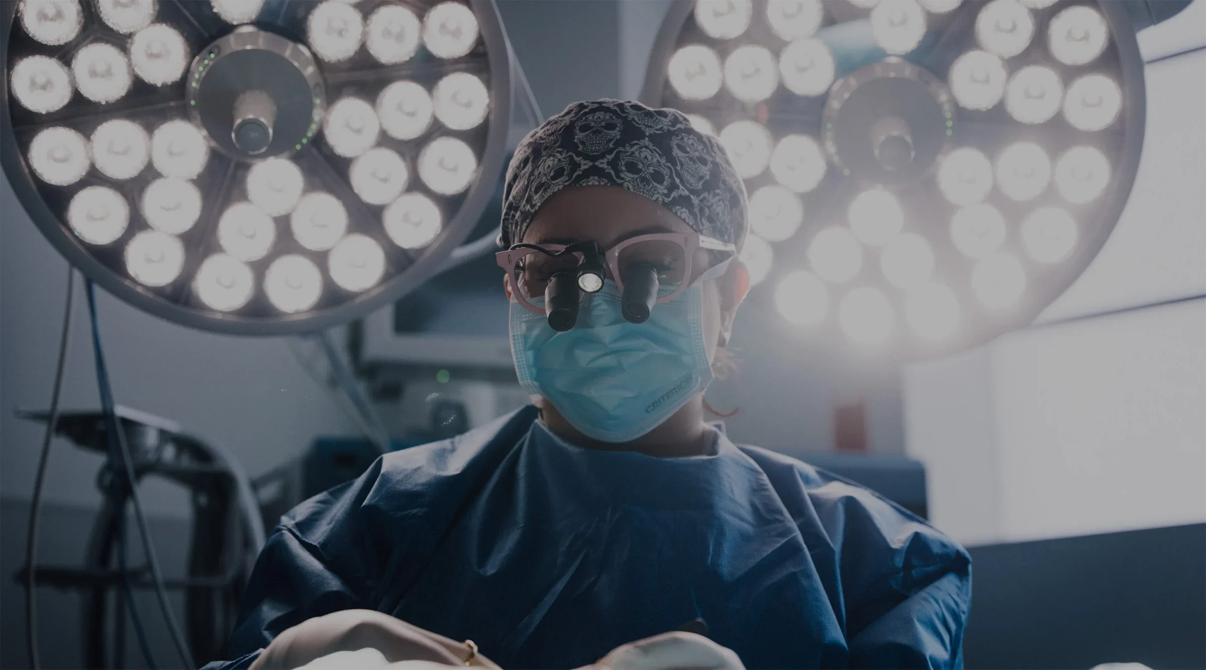Female plastic surgeon performing customized labiaplasty